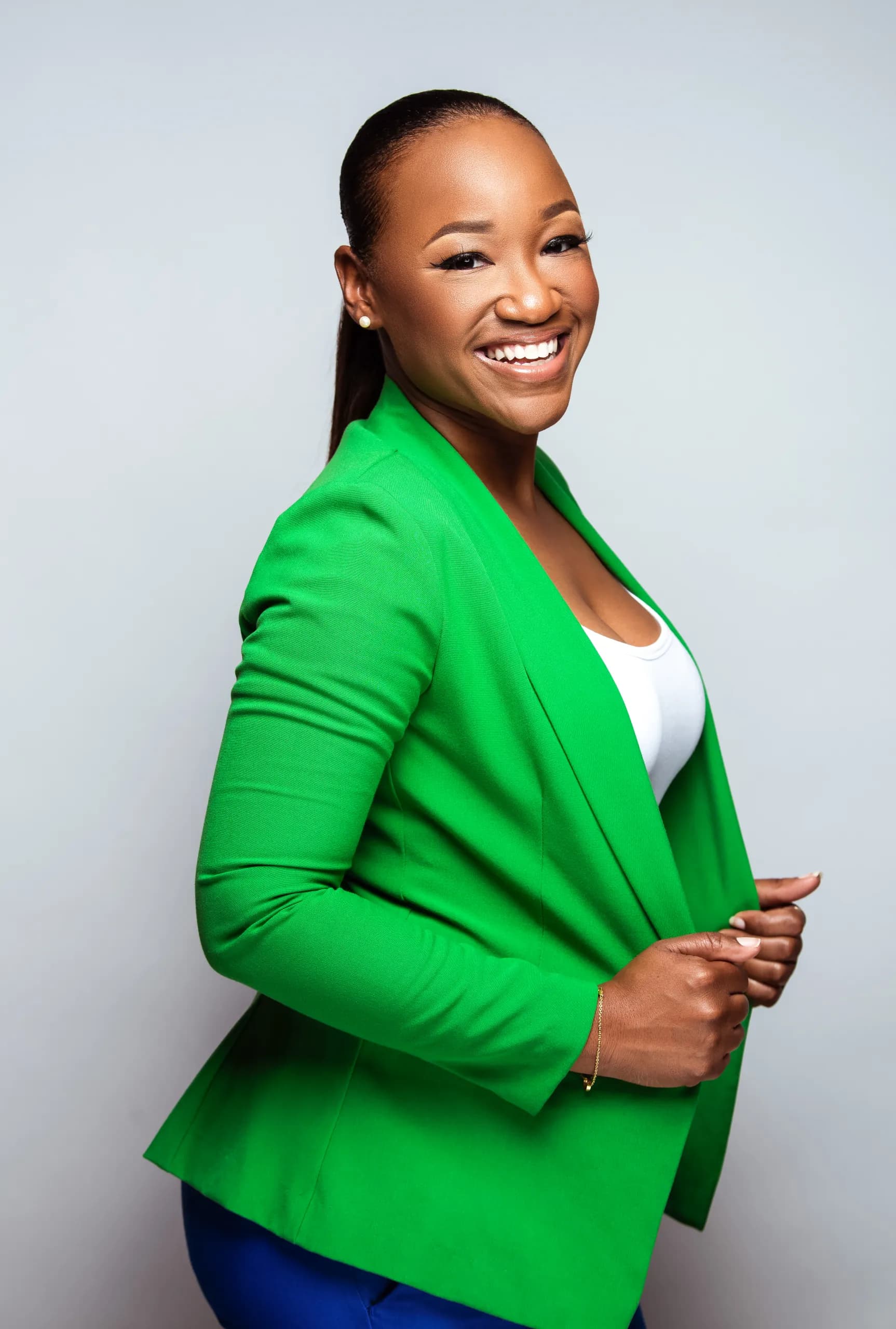 Petra Haven in a green blazer, laughing